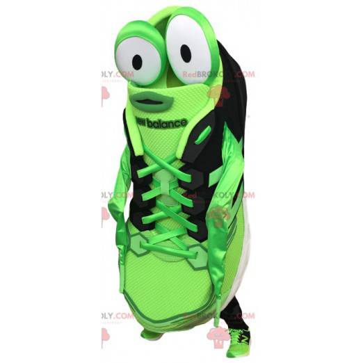 Mascotte di scarpe sportive verdi e nere con grandi occhi -