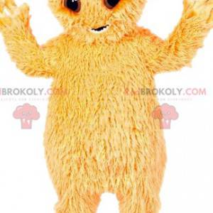 Mascote pequeno monstro peludo amarelo. - Redbrokoly.com