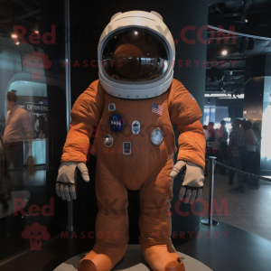 Brown Astronaut mascot costume character dressed with a Chambray Shirt and Foot pads
