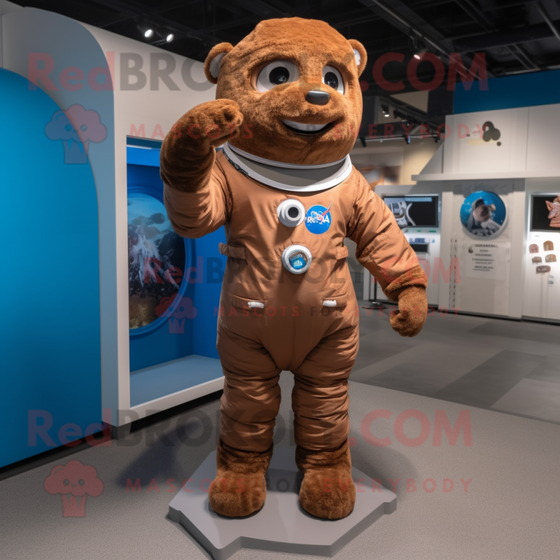 Brown Astronaut mascot costume character dressed with a Chambray Shirt and Foot pads