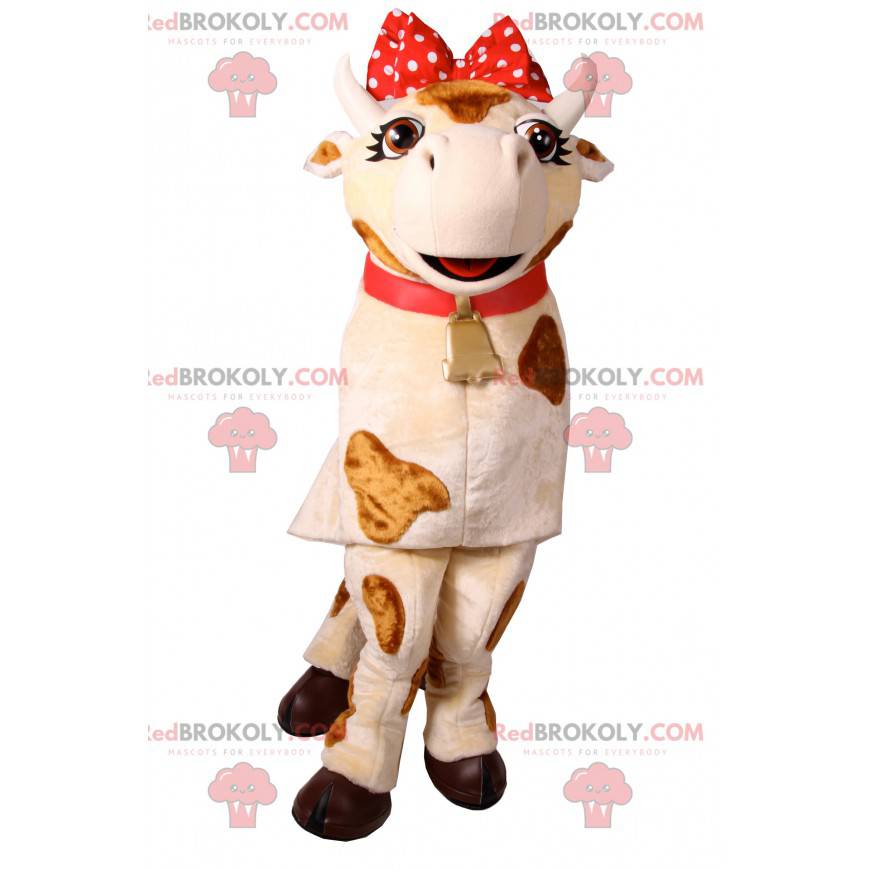 Mascotte de vache avec un nœud rouge à pois. Costume de vache - Mascotte de vache avec un nœud rouge à pois. Costume de vache -