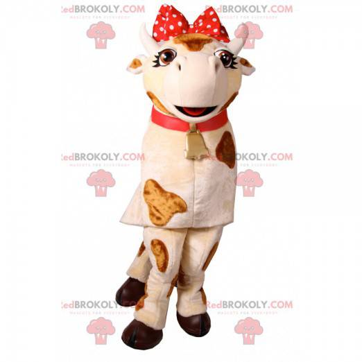 Mascotte della mucca con un nodo rosso a pois. Costume da mucca