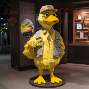 Yellow Dodo Bird mascot costume character dressed with a Bomber Jacket and Hat pins