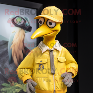 Yellow Dodo Bird mascot costume character dressed with a Bomber Jacket and Hat pins