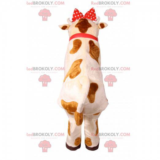 Mascota de la vaca con un nodo de lunares rojos. Disfraz de