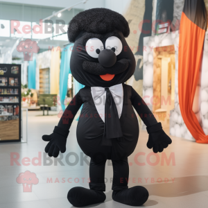 Black Moussaka mascot costume character dressed with a Romper and Bow ties