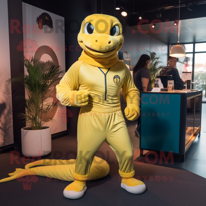 Yellow Anaconda mascot costume character dressed with a Joggers and Brooches