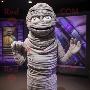 Gray Mummy mascot costume character dressed with a Bodysuit and Scarves