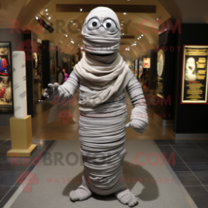 Gray Mummy mascot costume character dressed with a Bodysuit and Scarves