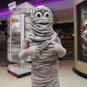 Gray Mummy mascot costume character dressed with a Bodysuit and Scarves