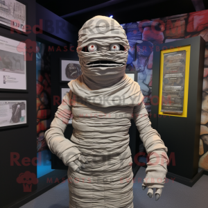 Gray Mummy mascot costume character dressed with a Bodysuit and Scarves