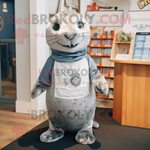 Silver Seal mascot costume character dressed with a Oxford Shirt and Headbands