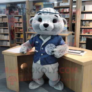 Silver Seal mascot costume character dressed with a Oxford Shirt and Headbands