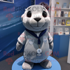 Silver Seal mascot costume character dressed with a Oxford Shirt and Headbands