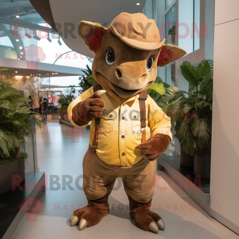 Brown Triceratops mascot costume character dressed with a Overalls and Hat pins