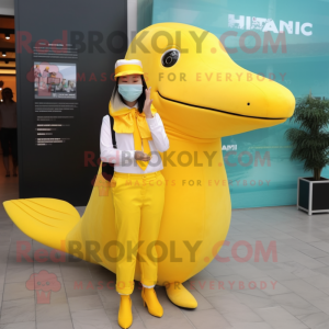 Yellow Humpback Whale mascot costume character dressed with a Dress and Digital watches