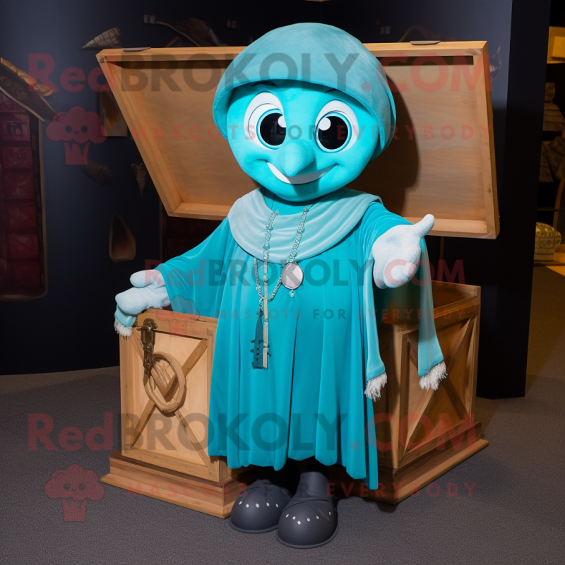 Cyan Treasure Chest mascot costume character dressed with a Cover-up and Shawl pins Cyan Treasure Chest mascot costume character dressed with a Cover-up and Shawl pins
