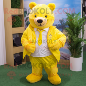 Personaggio del costume della mascotte dell orso giallo limone vestito con  una maglietta e fazzoletti da taschino