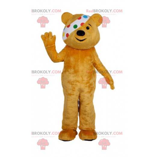 Mascotte orso giallo con una benda. Costume da orso giallo -