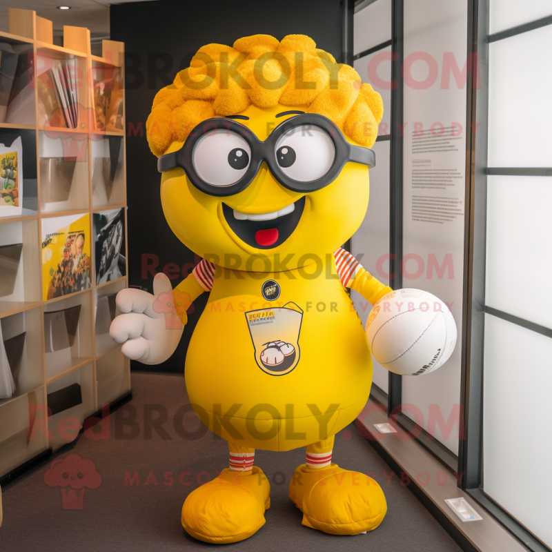 Yellow Meatballs mascot costume character dressed with a Rugby Shirt and Eyeglasses