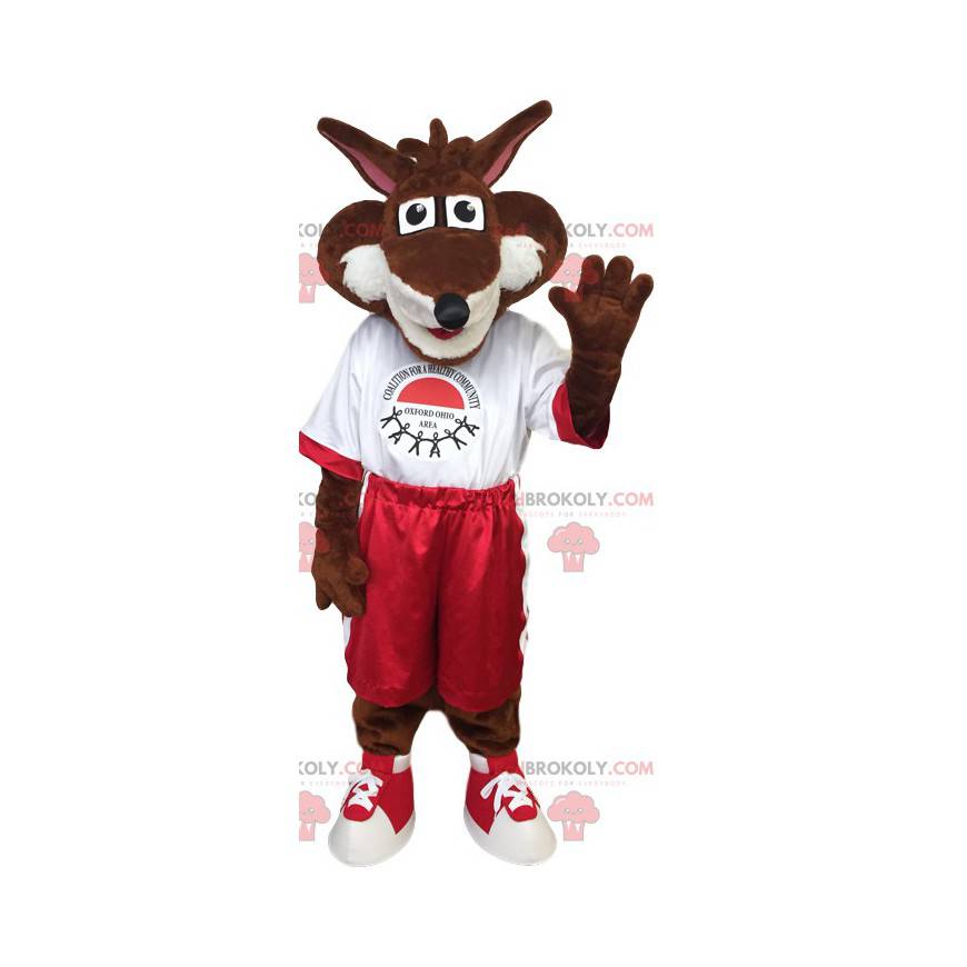 Mascotte bruine vos in rode en witte sportkleding -