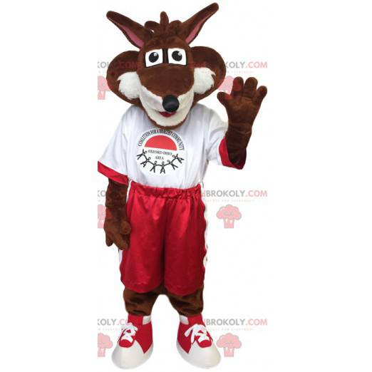 Mascotte bruine vos in rode en witte sportkleding -