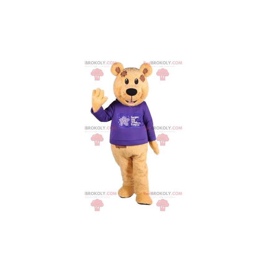 Mascotte d'ours brun avec un maillot bleu. Costume d'ours -