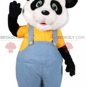 Mascota de panda en overol de jeans y con un sombrero -