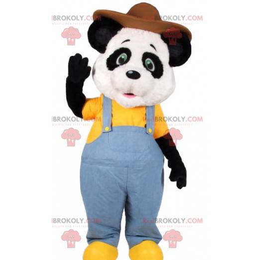 Mascota de panda en overol de jeans y con un sombrero -