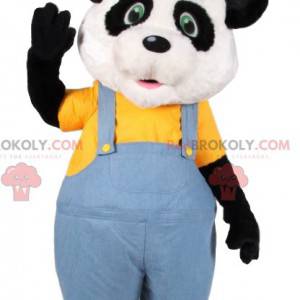 Mascota de panda en overol de jeans y con un sombrero -