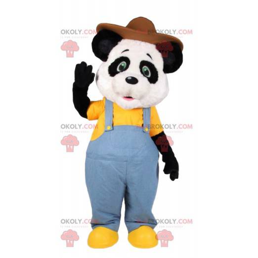 Mascota de panda en overol de jeans y con un sombrero -