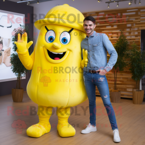 Lemon Yellow Goulash mascot costume character dressed with a Boyfriend Jeans and Belts