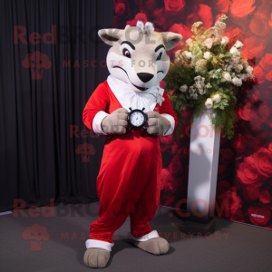 Red Thylacosmilus mascot costume character dressed with a Wedding Dress and Smartwatches