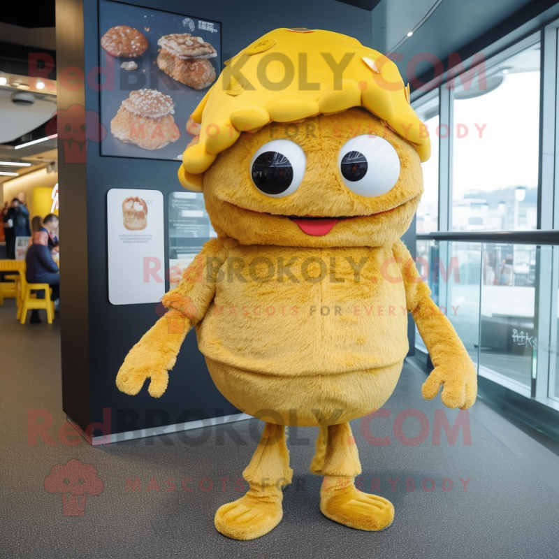 Gold Crab Cakes mascot costume character dressed with a Cardigan and Beanies