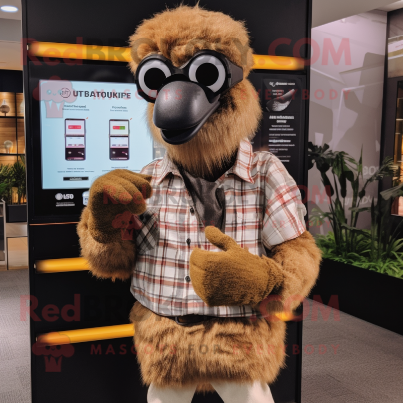 Brown Ostrich mascot costume character dressed with a Flannel Shirt and Smartwatches