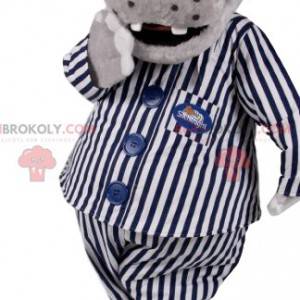 Grijze hyppotamus mascotte in gestreepte pyjama. -