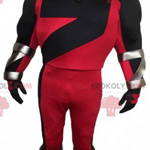 Mascota de superhéroe enmascarado en rojo y negro -
