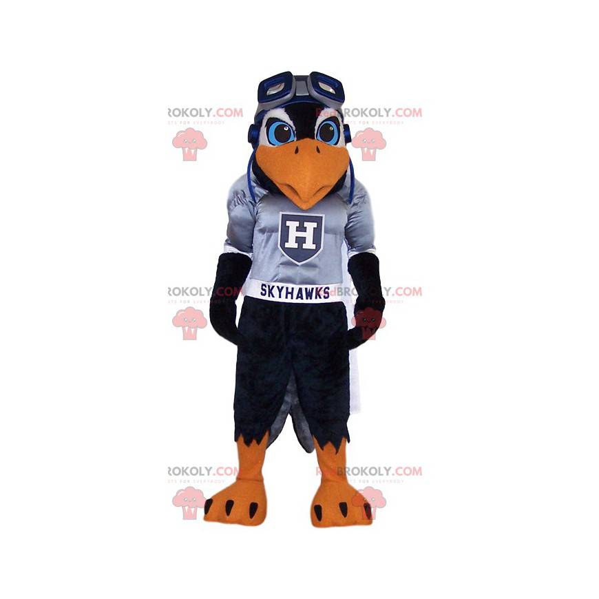 Mascotte d'aigle noir en maillot de supporter gris -