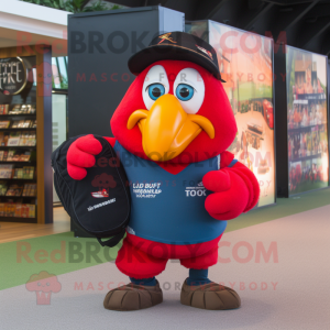 Red Toucan mascot costume character dressed with a Rugby Shirt and Backpacks