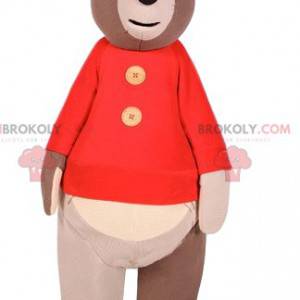 Mascote do urso pardo com um suéter vermelho. Fantasia de urso
