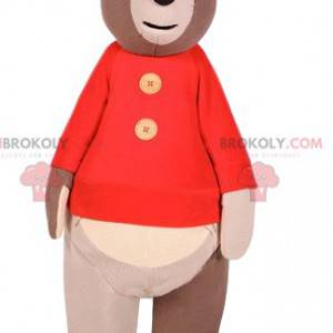 Mascotte dell'orso bruno con un maglione rosso. Costume da orso