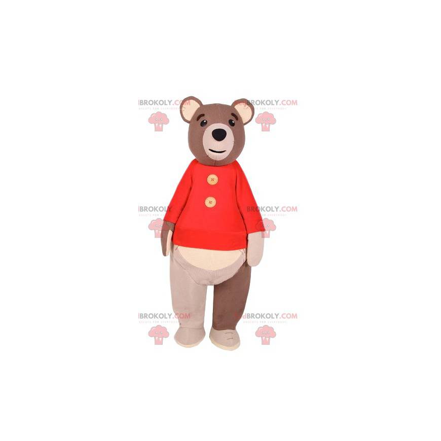 Mascote do urso pardo com um suéter vermelho. Fantasia de urso