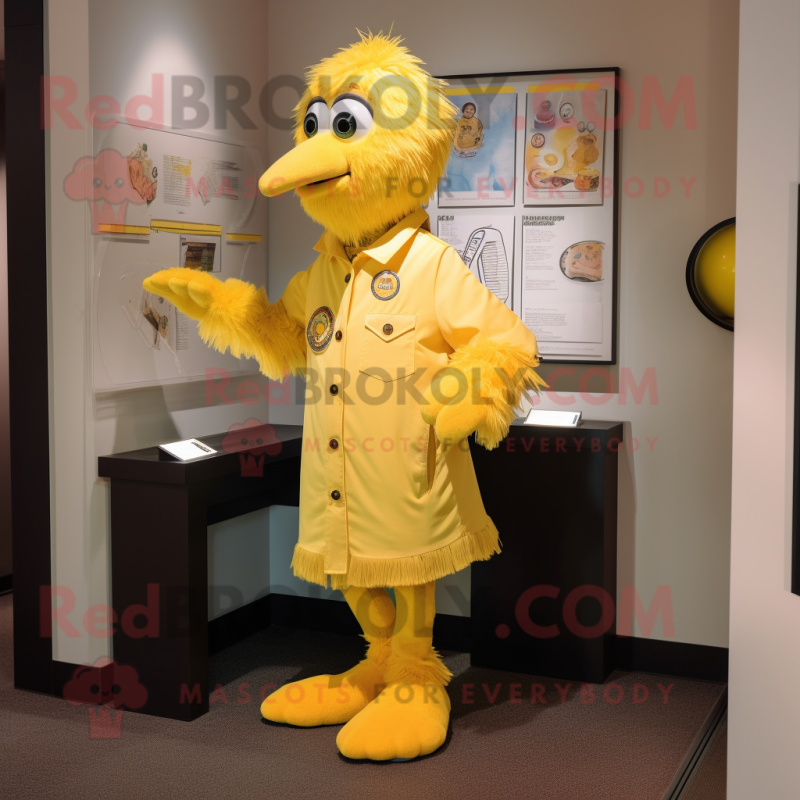 Yellow Momentum mascot costume character dressed with a Button-Up Shirt and Shawl pins