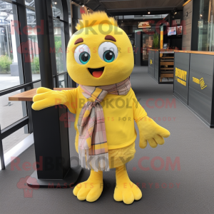 Yellow Momentum mascot costume character dressed with a Button-Up Shirt and Shawl pins