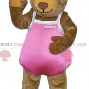 Maskotka niedźwiedź brunatny w różowym stroju kąpielowym -