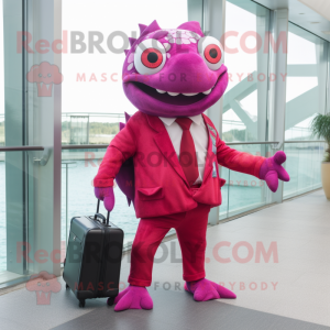 Magenta Piranha mascot costume character dressed with a Suit Jacket and Briefcases