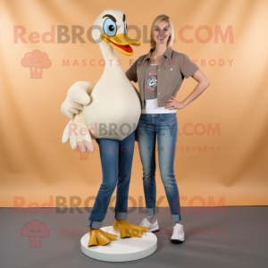 Tan Swan mascot costume character dressed with a Bootcut Jeans and Shoe clips