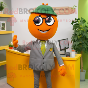 Olive Orange mascot costume character dressed with a Pencil Skirt and Cufflinks