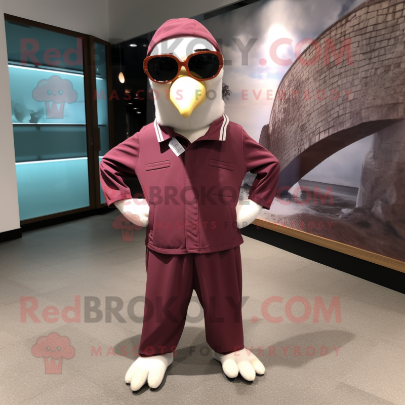 Maroon Albatross mascot costume character dressed with a Jumpsuit and Eyeglasses