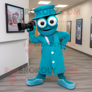 Teal Camera mascot costume character dressed with a Dress Pants and Headbands